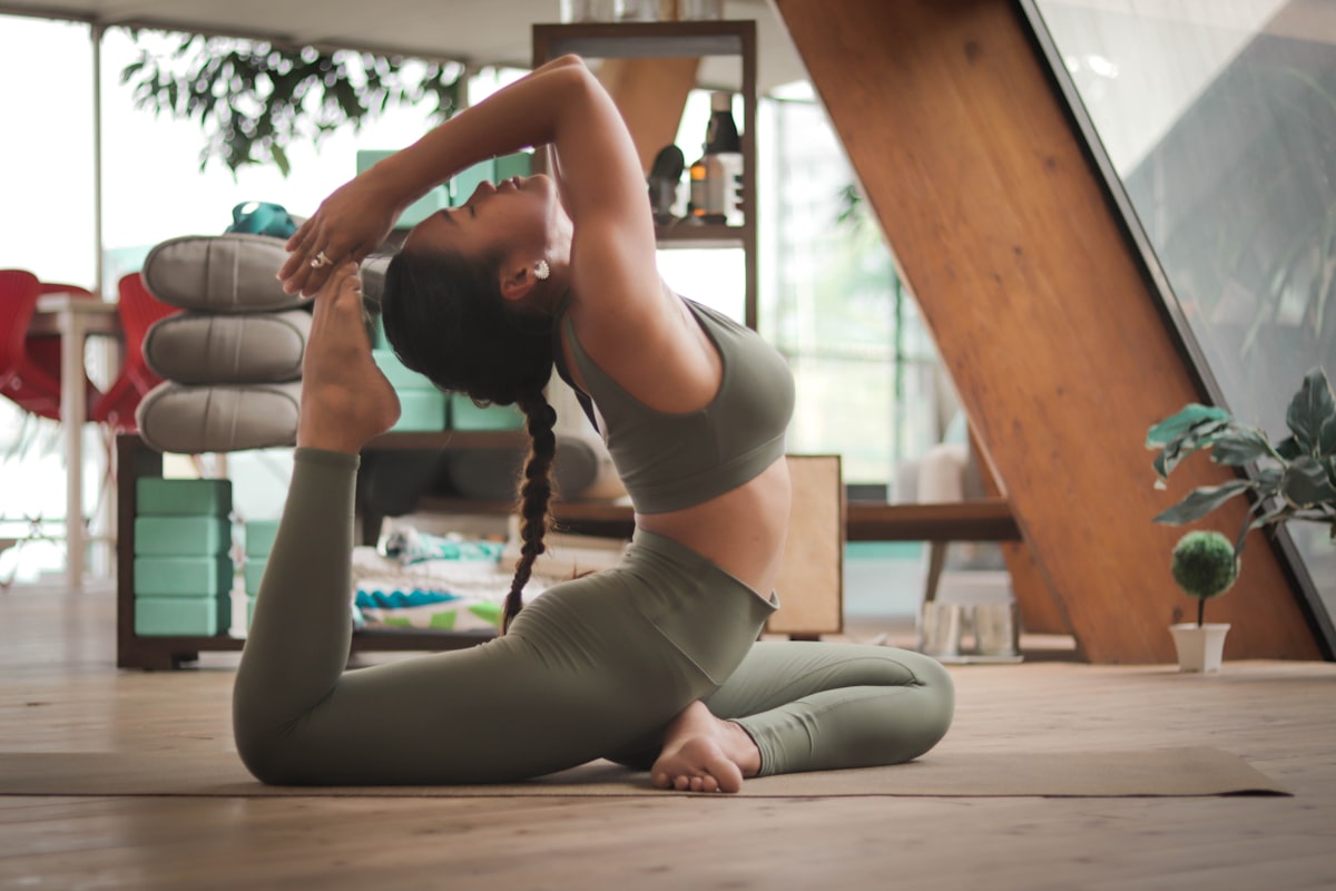 Yoga student in a standing vinyasa flow pose